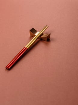 Chopsticks for sushi or other Japanese or Chinese food on a brownstone table. Asian chopsticks