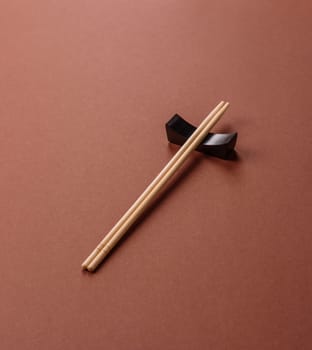 Chopsticks for sushi or other Japanese or Chinese food on a brownstone table. Asian chopsticks