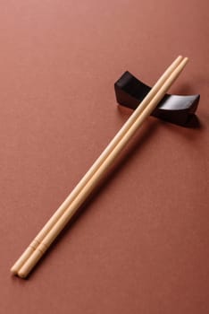 Chopsticks for sushi or other Japanese or Chinese food on a brownstone table. Asian chopsticks