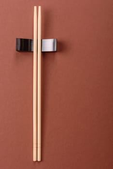 Chopsticks for sushi or other Japanese or Chinese food on a brownstone table. Asian chopsticks