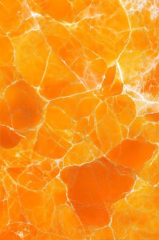 A high-resolution yellow marble background with striking white veins, offering a luxurious and polished texture perfect for various design and decor projects.