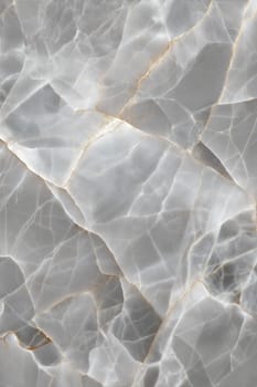 A beautiful grey marble background with fine cracks and golden veins. Perfect for luxurious and sophisticated designs.