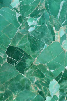 A high-quality green marble background featuring white veins and cracks, creating a vibrant and elegant texture for design projects. Ideal for nature-inspired and luxurious designs.