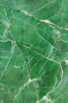 A high-detailed green marble background featuring natural veins and cracks, perfect for luxury design and creative projects.