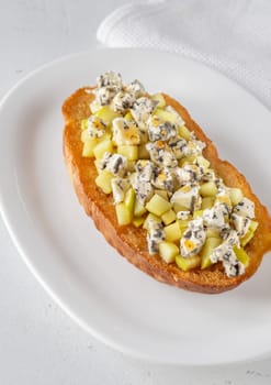 Golden toast hugs melted blue cheese, sweet apples, and warm honey drizzle