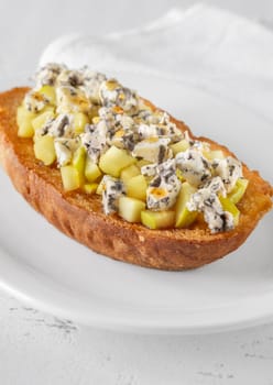 Golden toast hugs melted blue cheese, sweet apples, and warm honey drizzle