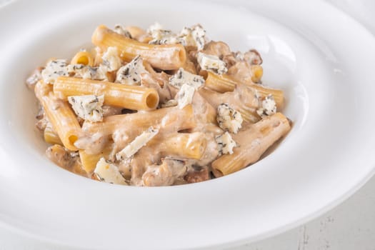Soft penne coated in rich walnut sauce with crumbled sharp blue cheese