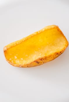 Golden dipper rests alone in focus, edges crisp and texture richly detailed