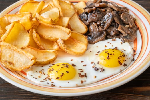 A hearty breakfast dish with crisp dippers, runny eggs, and sauteed mushrooms