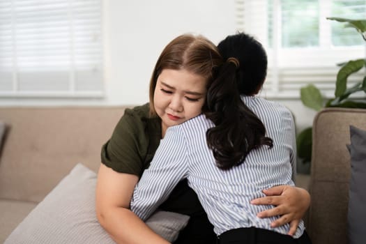 The psychiatrist embraces her client, providing a safe space to express vulnerability and fostering emotional healing during the therapy session.