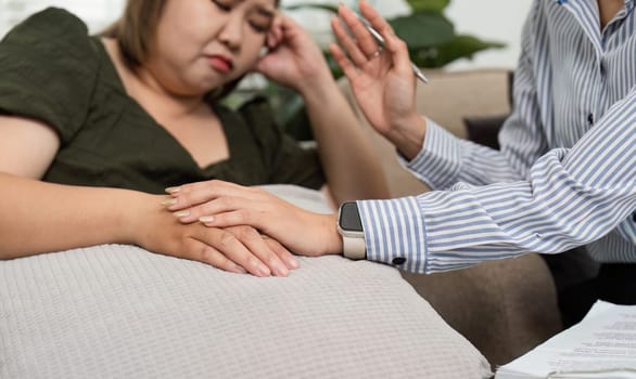 The psychiatrist gently reassures her patient while encouraging open dialogue, ensuring a nurturing atmosphere for discussing mental health concerns.