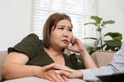 During a meaningful consultation, the psychiatrist provides an empathic ear to her patient, focusing on emotional struggles and offering compassionate support.
