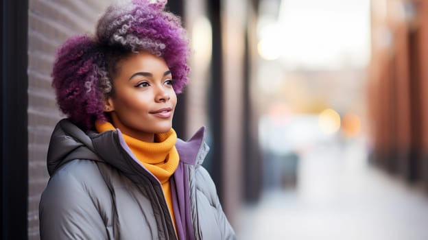 Portrait of stylish young African woman with purple dyed hair, beautiful black girl wearing a jacket standing on a city street, looking away