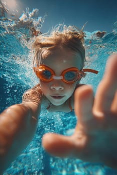 A determined child with orange goggles swims underwater, reaching out in a sunny blue pool. Perfect for summer themes, sports, family fun, and lifestyle visuals