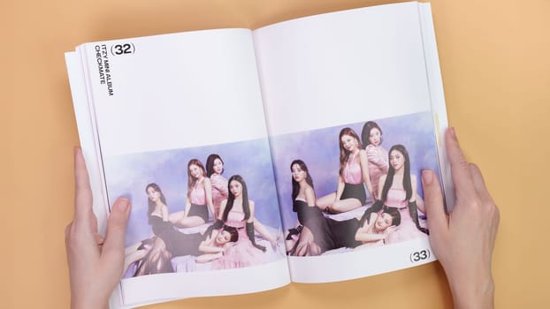 Gatineau, QC Canada - 03.16.2024: K-pop group Itzy Guess Who music Album on yellow background. Special edition music CD. South Korean girl group Itzy