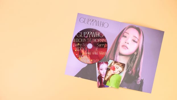 Gatineau, QC Canada - 03.16.2024: K-pop group Itzy Guess Who music Album on yellow background. Special edition music CD. South Korean girl group Itzy
