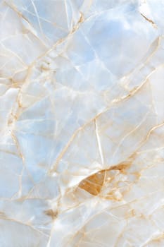 A stunning marble background featuring delicate golden veins and soft light blue hues. Ideal for luxury designs, branding, and elegant decor.
