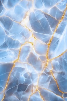 A luxurious blue marble background adorned with golden veins, ideal for design, branding, and artistic projects. This elegant texture adds sophistication to any visual.
