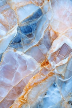 Elegant marble background featuring soft pastel hues of blue, pink, and orange with subtle golden veins, perfect for artistic, luxurious, and modern designs.