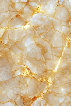 A beautiful close-up of a luxurious marble background featuring golden veins running through a creamy, translucent surface. Perfect for elegant and sophisticated designs.