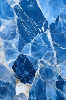 A stunning blue marble background featuring abstract textures and golden veins. Ideal for modern, luxurious design and artistic projects.