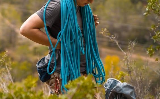 Man with a rope climbing in the mountains. Climbing in the mountains of Spain. Technical mountaineering.