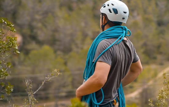 Man with a rope climbing in the mountains. Climbing in the mountains of Spain. Technical mountaineering.