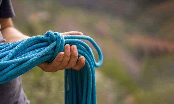 Man with a rope climbing in the mountains. Climbing in the mountains of Spain. Technical mountaineering.