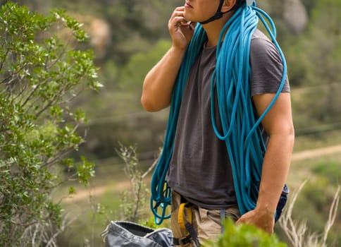Man with a rope climbing in the mountains. Climbing in the mountains of Spain. Technical mountaineering.