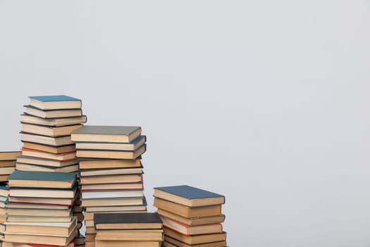Stacks of educational books on a white background of the library