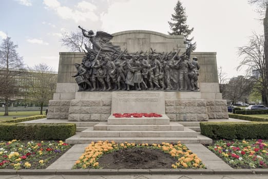 Newcastle, UK - Apr 14, 2025 - 'The Response 1914' is A war memorial to the Northumberland Fusiliers in the public gardens to the north of the Church of St Thomas the Martyr in Barras Bridge, Newcastle upon Tyne. use it as your Wallpaper, Poster and Space for text, Selective focus.