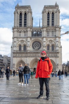 Paris, France - February 22nd 2025 : visitors in The Notre-Dame de Paris, newly re-opened cathedral restored after reconstruction, details of exterior