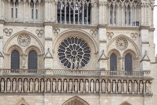 Paris, France - February 22nd 2025 : visitors in The Notre-Dame de Paris, newly re-opened cathedral restored after reconstruction, details of exterior