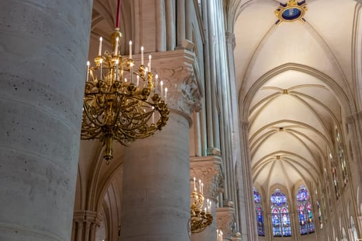 Paris, France - February 22nd 2025 : visitors in The Notre-Dame de Paris, newly re-opened cathedral restored after reconstruction, details of exterior