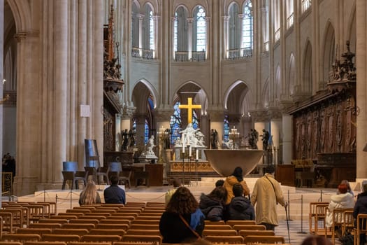 Paris, France - February 22nd 2025 : visitors in The Notre-Dame de Paris, newly re-opened cathedral restored after reconstruction, details of exterior
