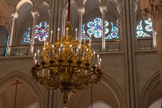 Paris, France - February 22nd 2025 : visitors in The Notre-Dame de Paris, newly re-opened cathedral restored after reconstruction, details of exterior