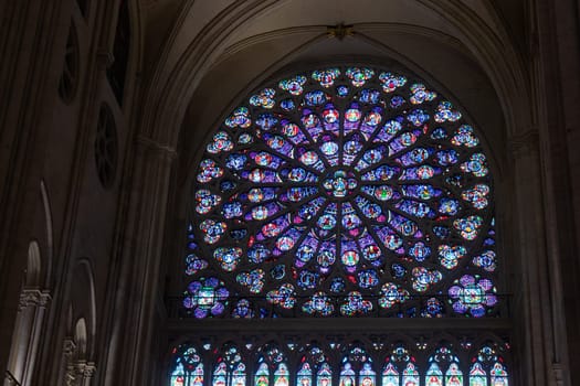 Paris, France - February 22nd 2025 : visitors in The Notre-Dame de Paris, newly re-opened cathedral restored after reconstruction, details of exterior