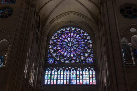 Paris, France - February 22nd 2025 : visitors in The Notre-Dame de Paris, newly re-opened cathedral restored after reconstruction, details of exterior