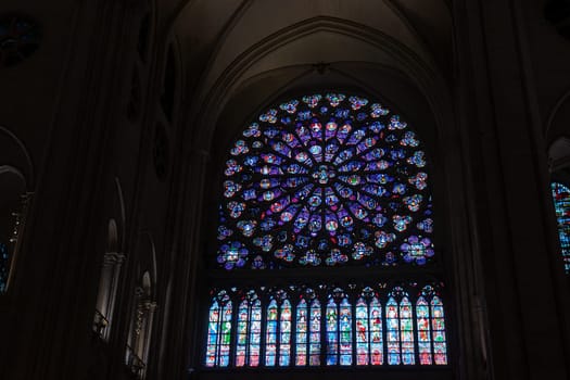 Paris, France - February 22nd 2025 : visitors in The Notre-Dame de Paris, newly re-opened cathedral restored after reconstruction, details of exterior