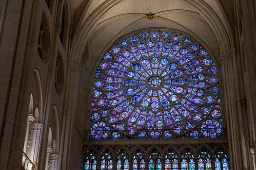 Paris, France - February 22nd 2025 : visitors in The Notre-Dame de Paris, newly re-opened cathedral restored after reconstruction, details of exterior