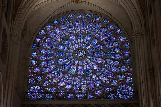 Paris, France - February 22nd 2025 : The Notre-Dame de Paris, newly re-opened cathedral restored after reconstruction, details of exterior, stained glass. UNESCO World Heritage Site