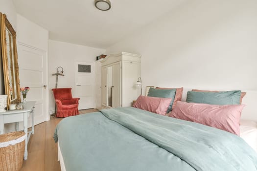 A serene bedroom featuring a soft color palette with gentle tones, modern furnishings, and a well-organized layout that promotes relaxation and comfort.