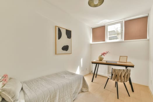 A serene, minimalist interior featuring a wooden desk, a stylish chair, and soft natural light streaming through the windows, enhancing the calm atmosphere.