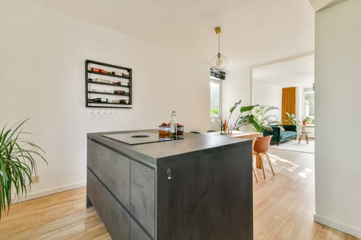 An elegant and contemporary kitchen featuring sleek cabinetry, a stylish island, and abundant natural light, creating a warm, inviting atmosphere.