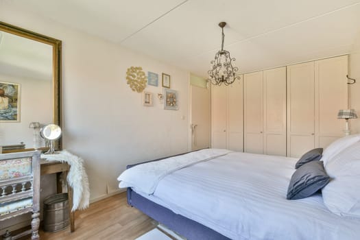 A serene bedroom featuring soft lighting, stylish decor, and a warm ambiance. The space includes a comfortable bed and tasteful furnishings that enhance relaxation.