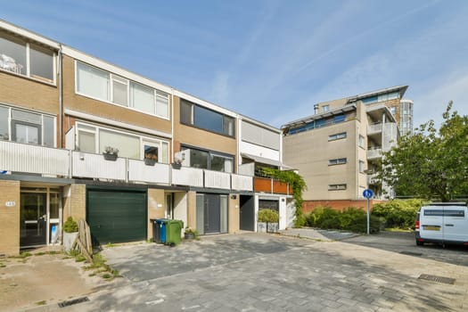 Features contemporary buildings and a well-maintained streetscape with greenery, showcasing urban living and architectural design.