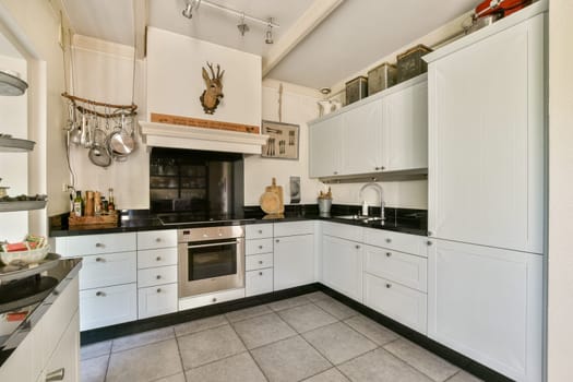 Stylish and contemporary kitchen featuring sleek cabinetry, a central cooking area, and organized storage solutions, ideal for culinary creativity.