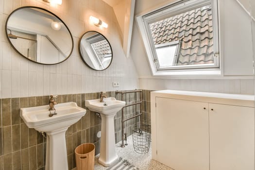 Stylish bathroom featuring elegant fixtures, round mirrors, and natural light. A perfect blend of functionality and aesthetic appeal.
