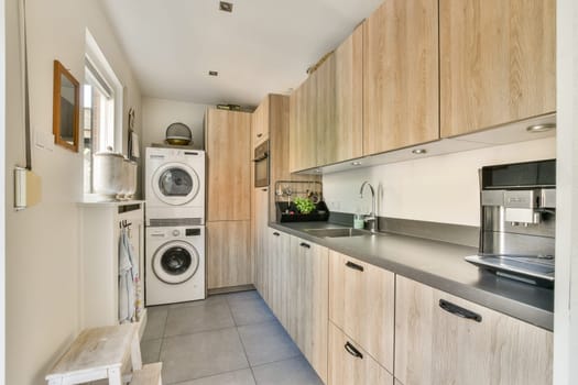 Sleek kitchen design featuring wooden cabinetry, integrated appliances, and a minimalist layout creating a functional cooking space.