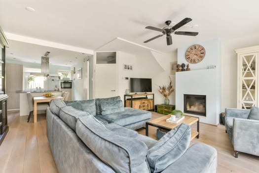 A stylish modern living room featuring a cozy arrangement of soft seating, natural lighting, and contemporary decor, perfect for relaxation and socializing.